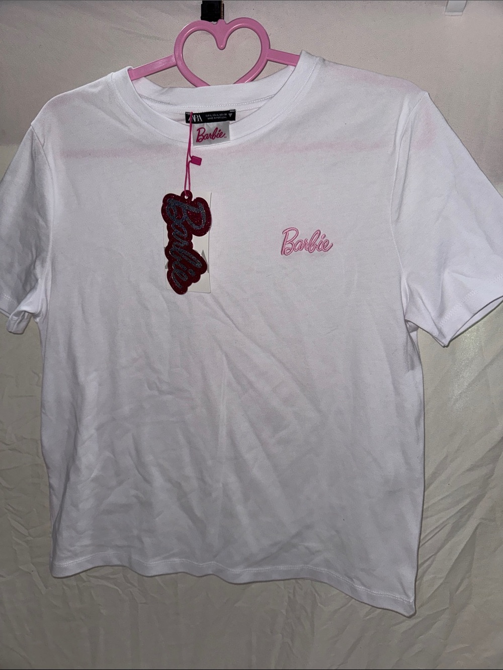 Zara women’s Barbie White Tee with Pink Script Logo